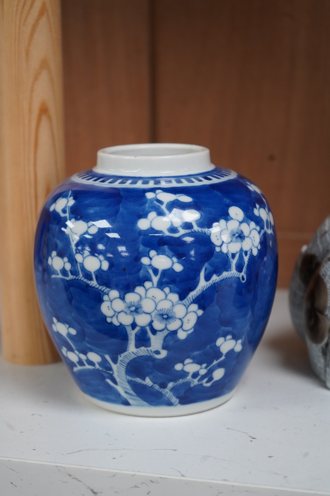 A 19th century Chinese blue and white small moon flask together with a later jar and a Portugese porcelain copy of a Chinese export cat, largest 19cm high